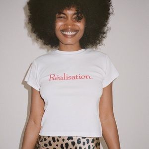 Réalisation Par Réal Logo Baby Tee